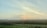 A serene sunrise over a peaceful landscape, symbolizing a fresh start to the day.