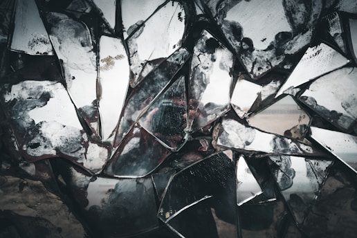 broken glass on brown sand