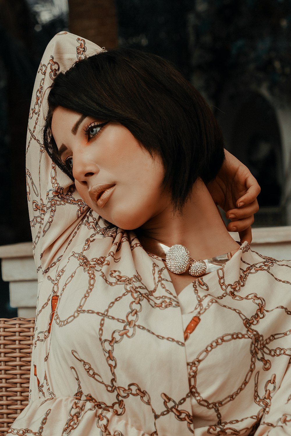 woman in white and brown floral hijab