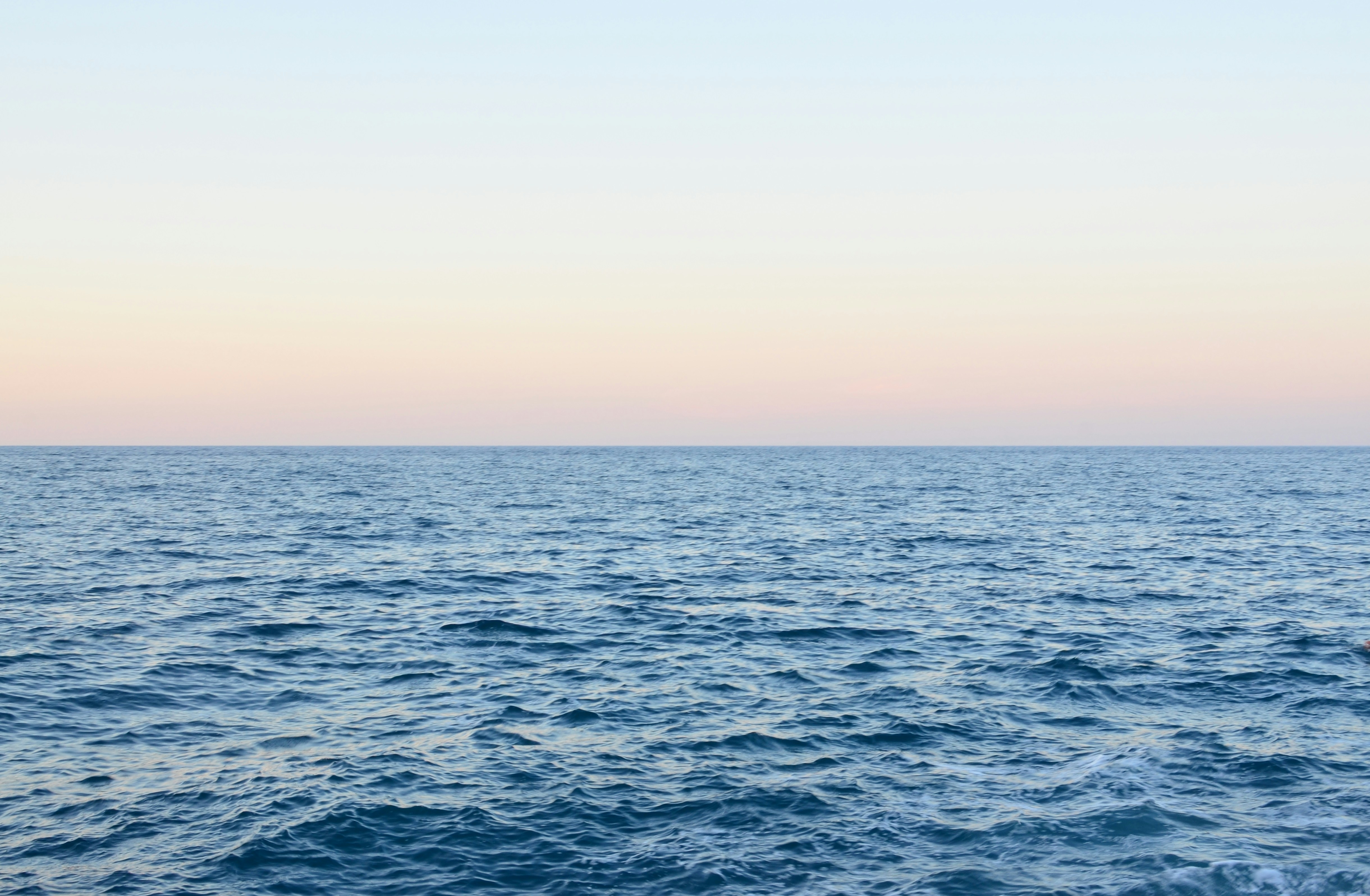 blue sea under white sky during daytime