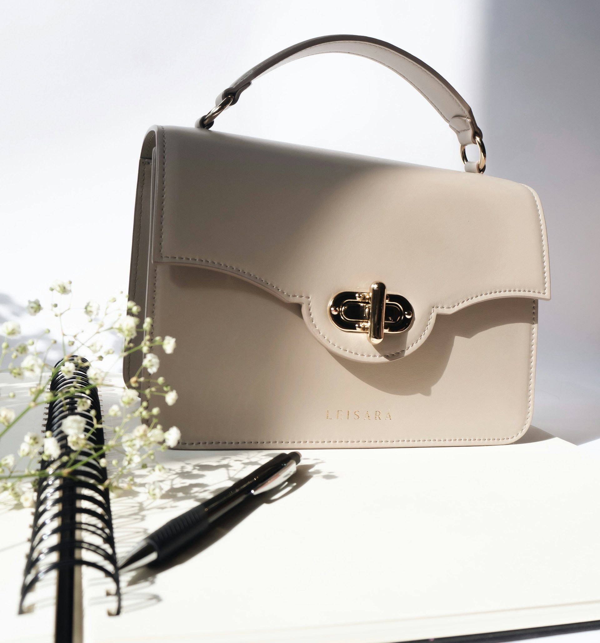 woman holding dried flower