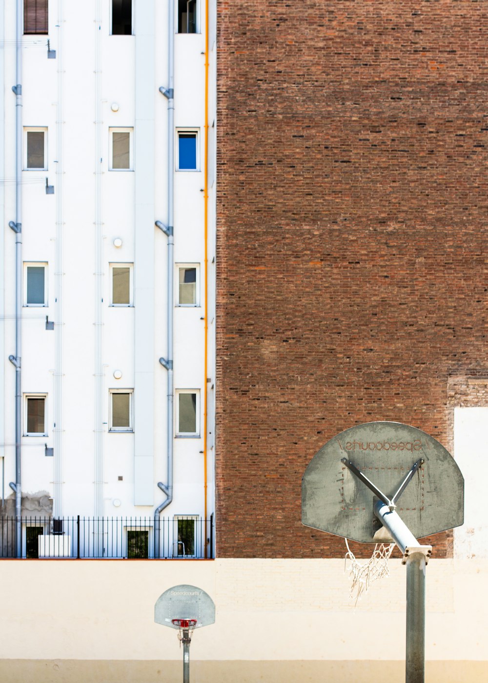 white and brown satellite dish on brown concrete wall