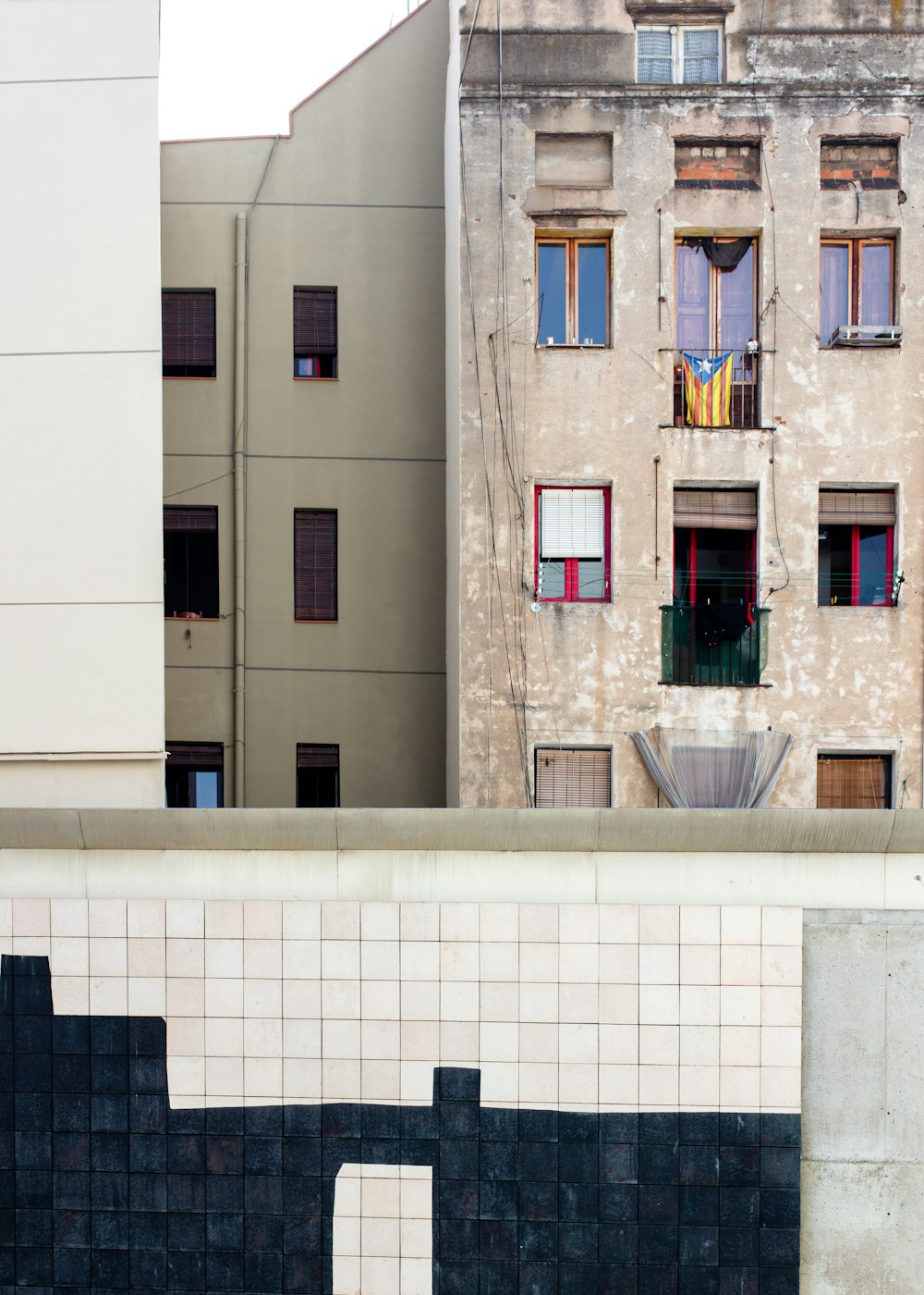 white concrete building with glass window