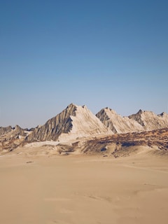 brown and white mountain under blue sky during daytime