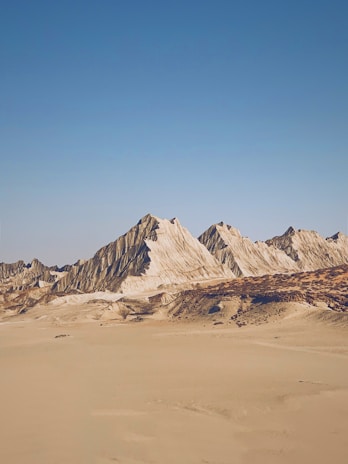 brown and white mountain under blue sky during daytime