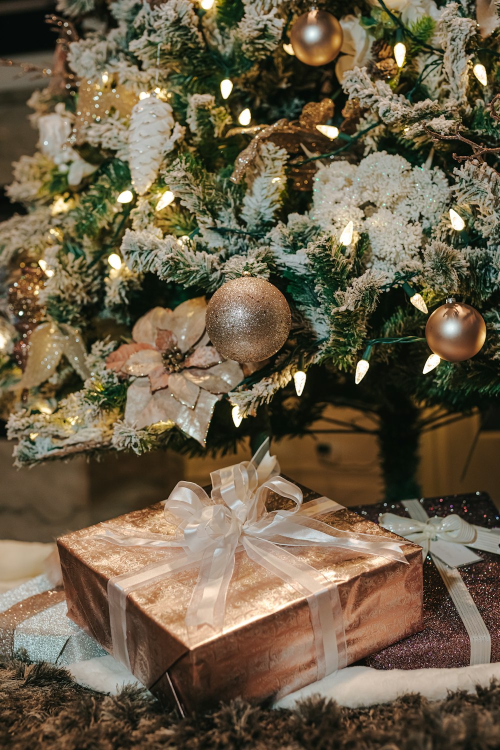 gold bauble on white and brown floral gift box