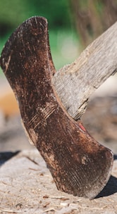 an old shoe is sitting on a piece of wood