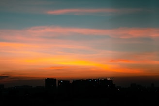 A stunning sunset over a scenic city skyline.