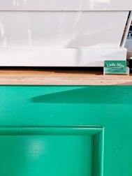 Screenshot of a clean, minimalist deal feed with green success buttons and slate gray text.