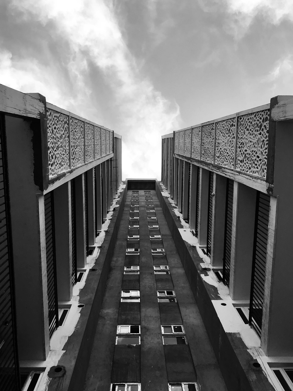 grayscale photo of concrete bridge