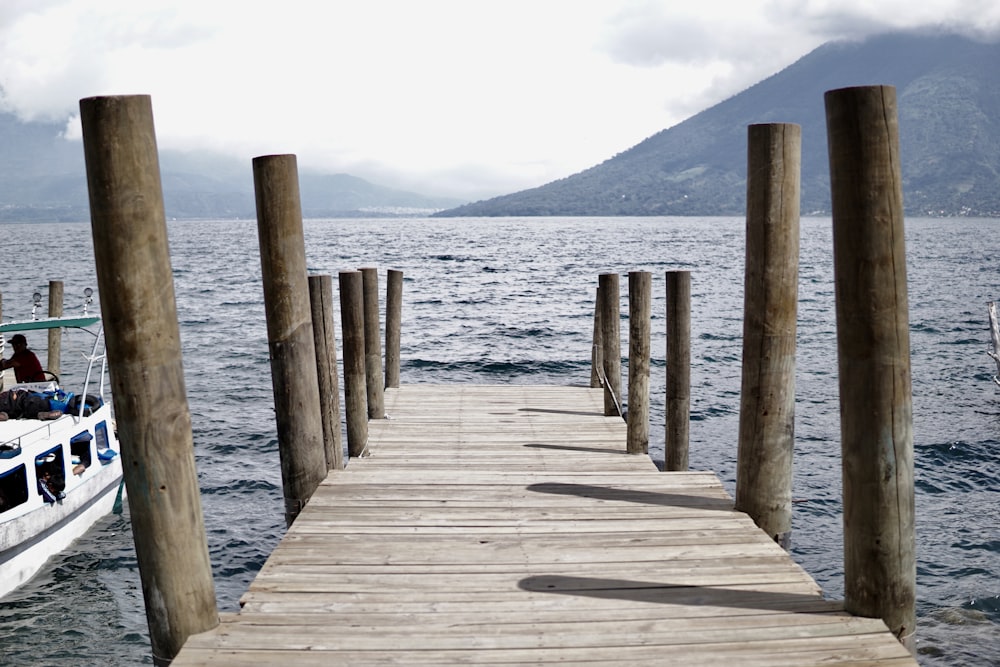 brown wooden dock on sea during daytime