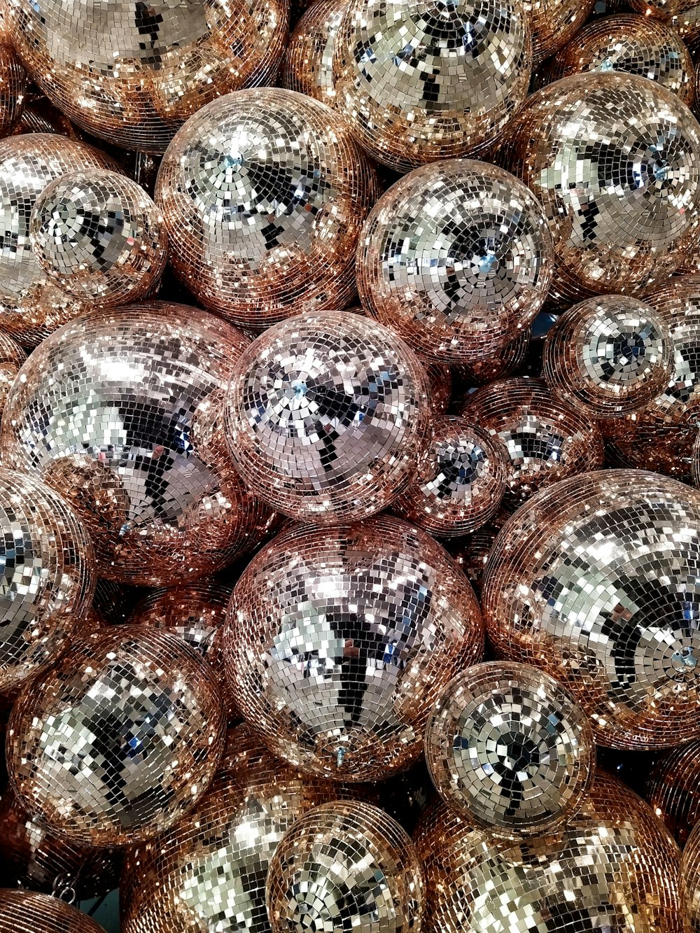 orange and silver baubles on clear glass container