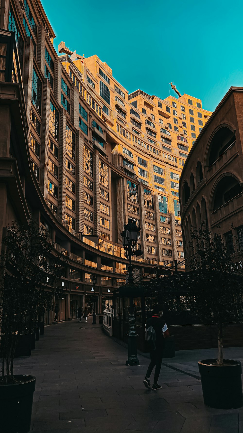 people walking on street near brown concrete building during daytime