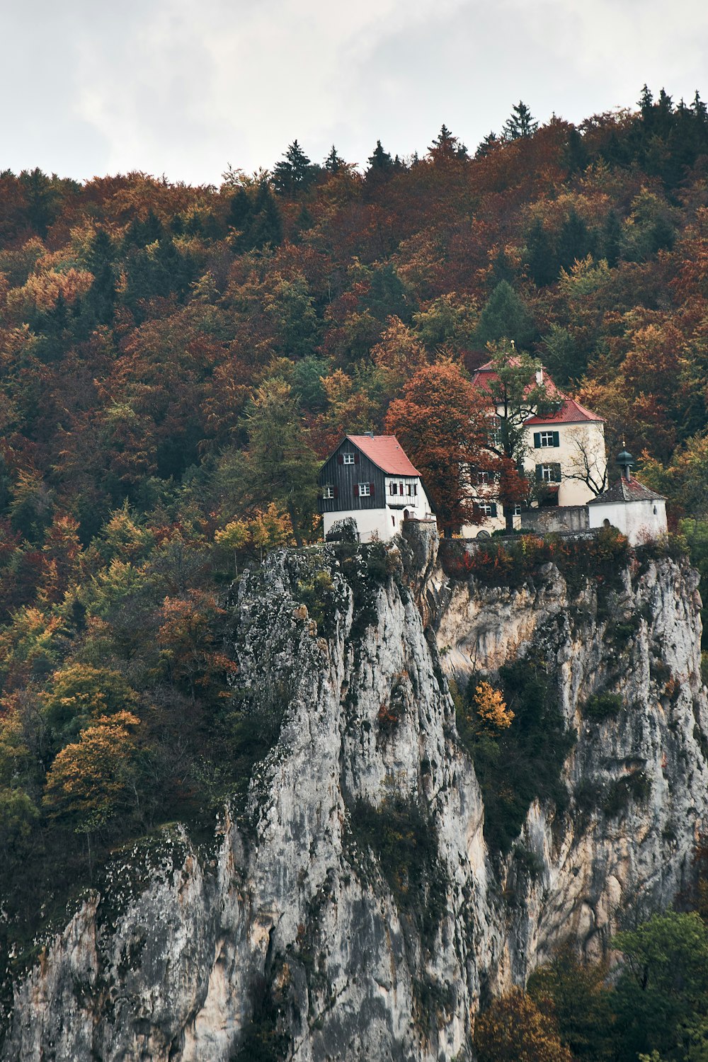 white and brown concrete house on top of mountain during daytime