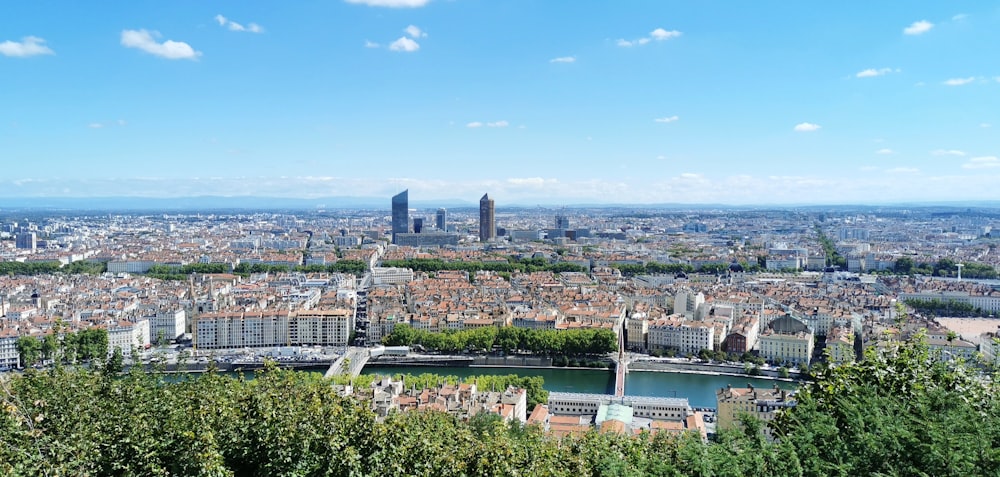 city buildings under blue sky during daytime