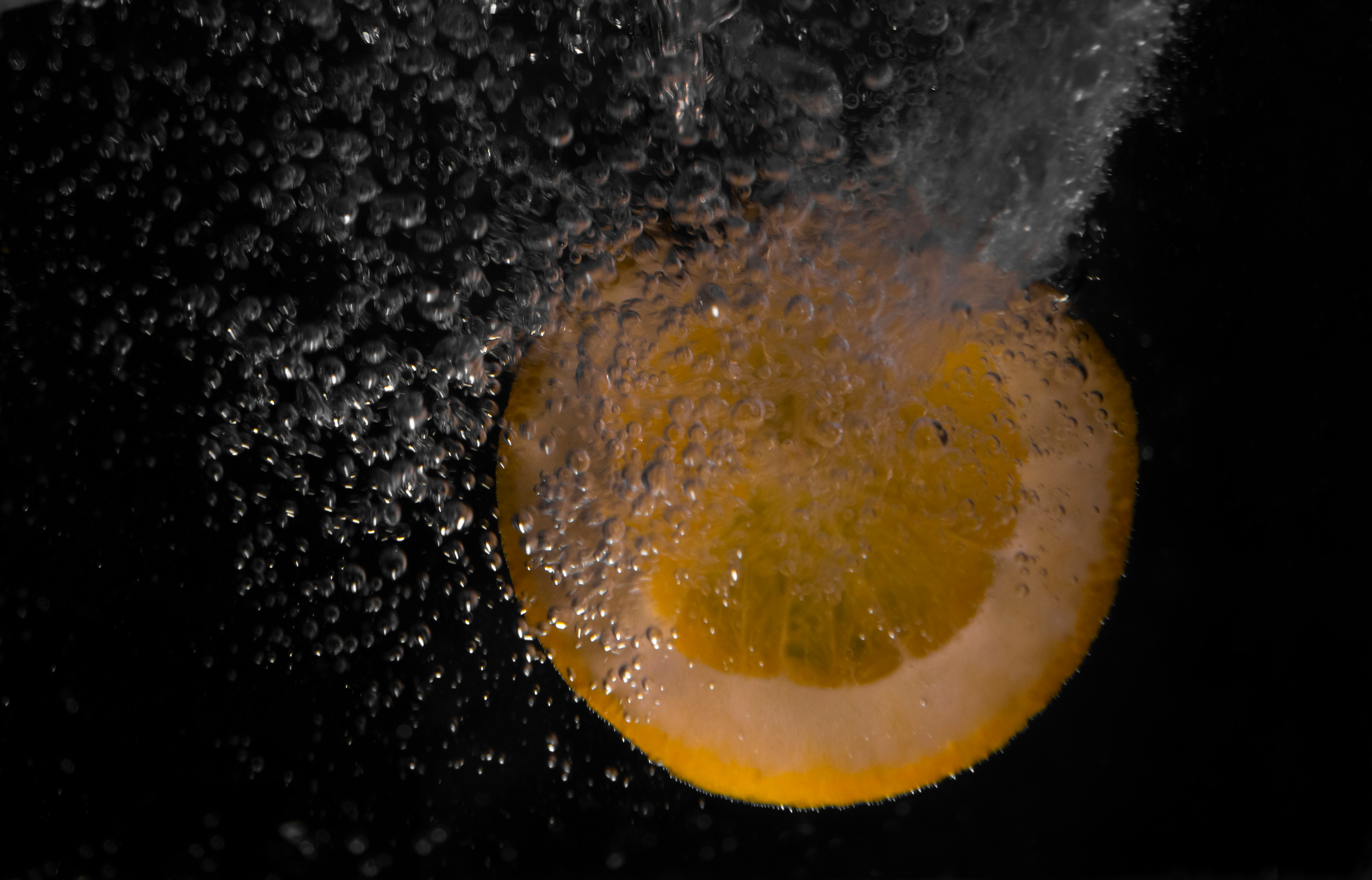 yellow moon in water with water droplets