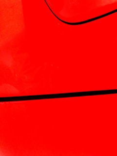 red textile on black textile