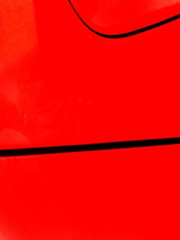 red textile on black textile