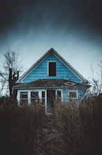 white and blue wooden house