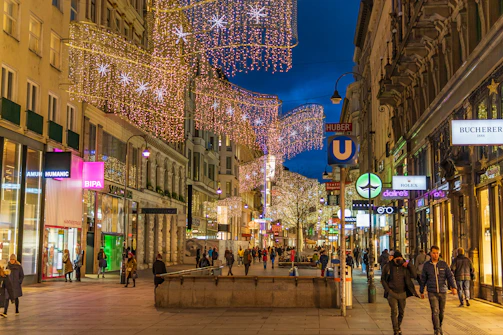 people walking on street during night time