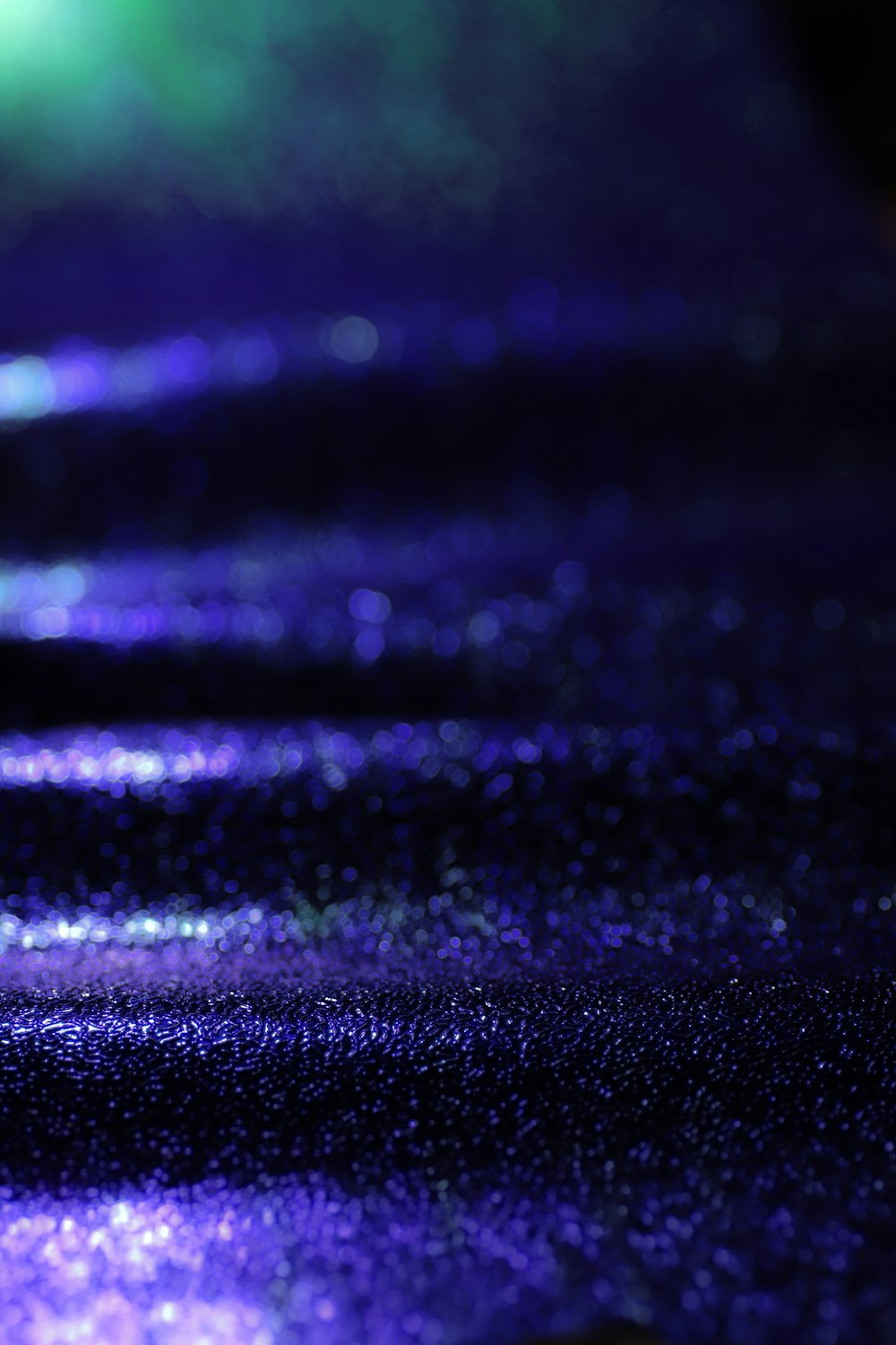 purple and black glittered textile