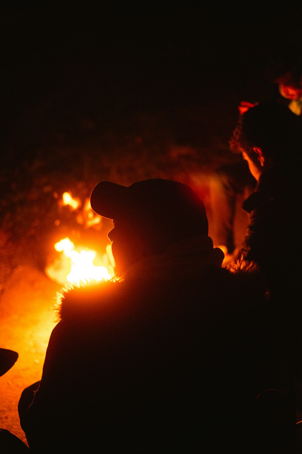 silhouette of man and woman kissing during night time