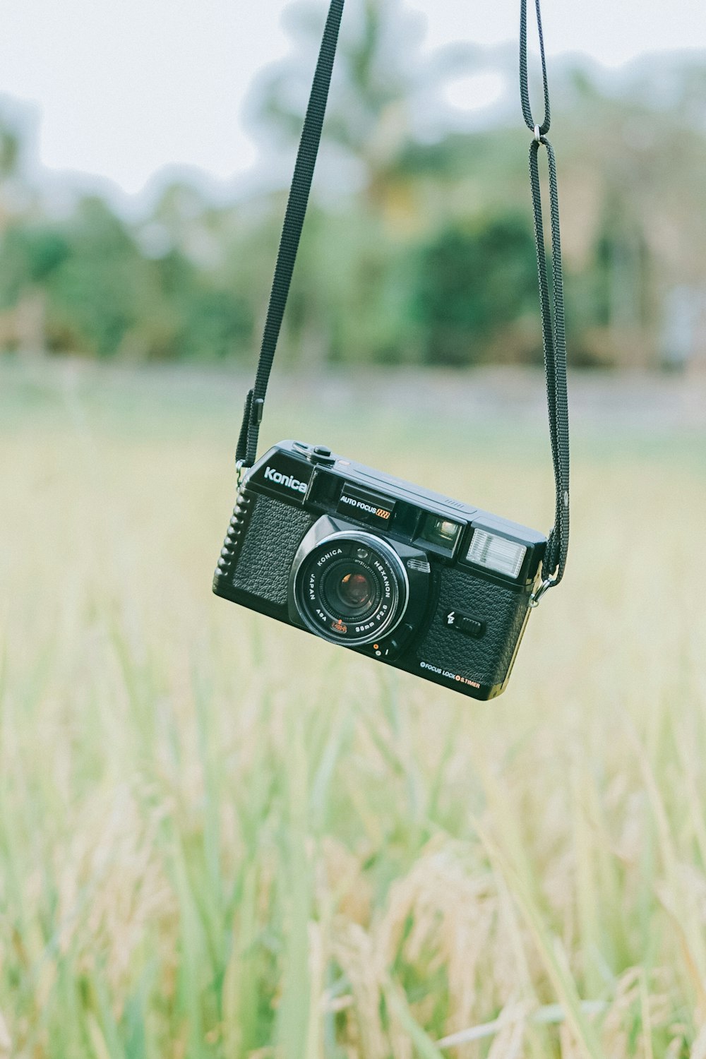 black and silver point and shoot camera