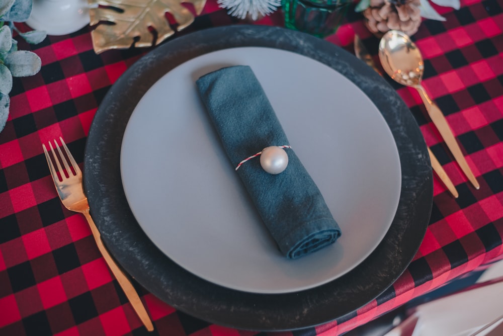 blue leather pouch on round white and black plate