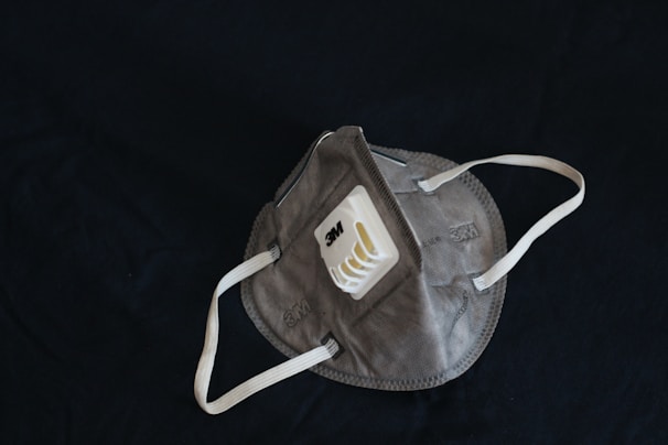 A Lifeguard Pro fire mask packaged and ready for shipment with the brand’s navy and red logo prominently displayed