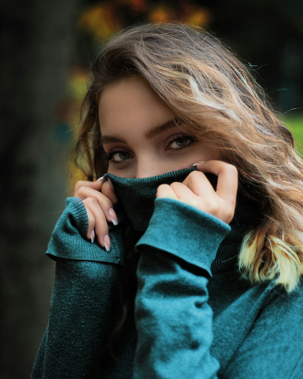 girl in green sweater covering her face with her hand photo – Free Clothing  Image on Unsplash