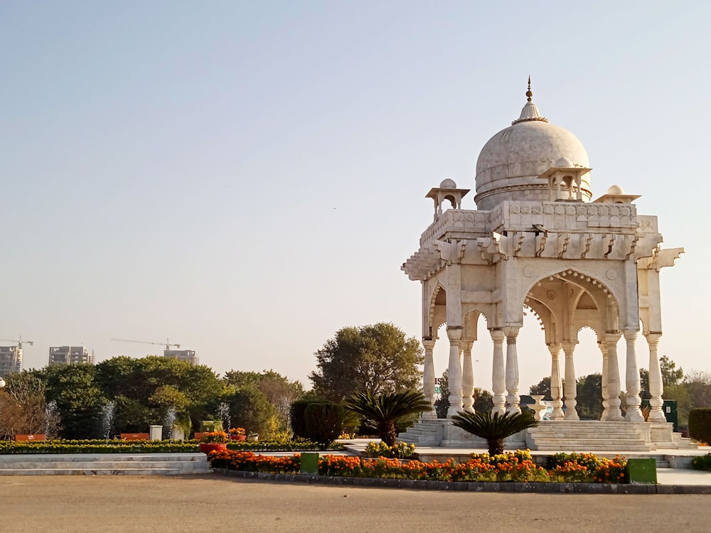 white dome building near green trees during daytime