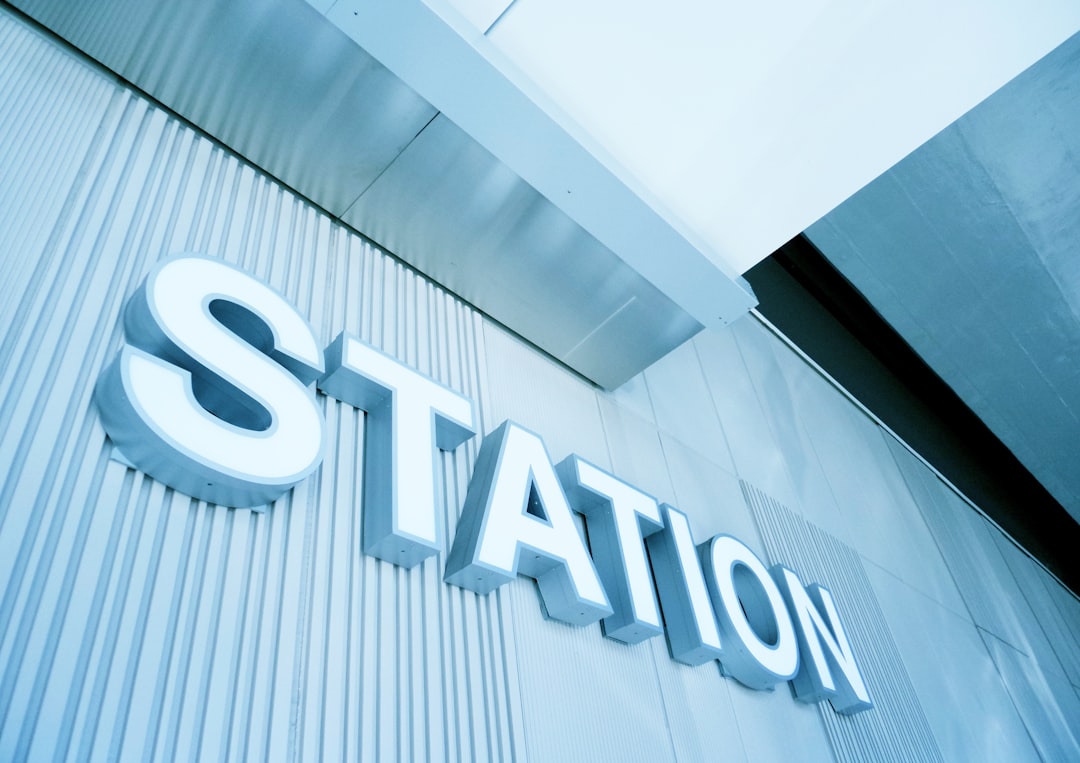 a sign that is on the side of a building, Station