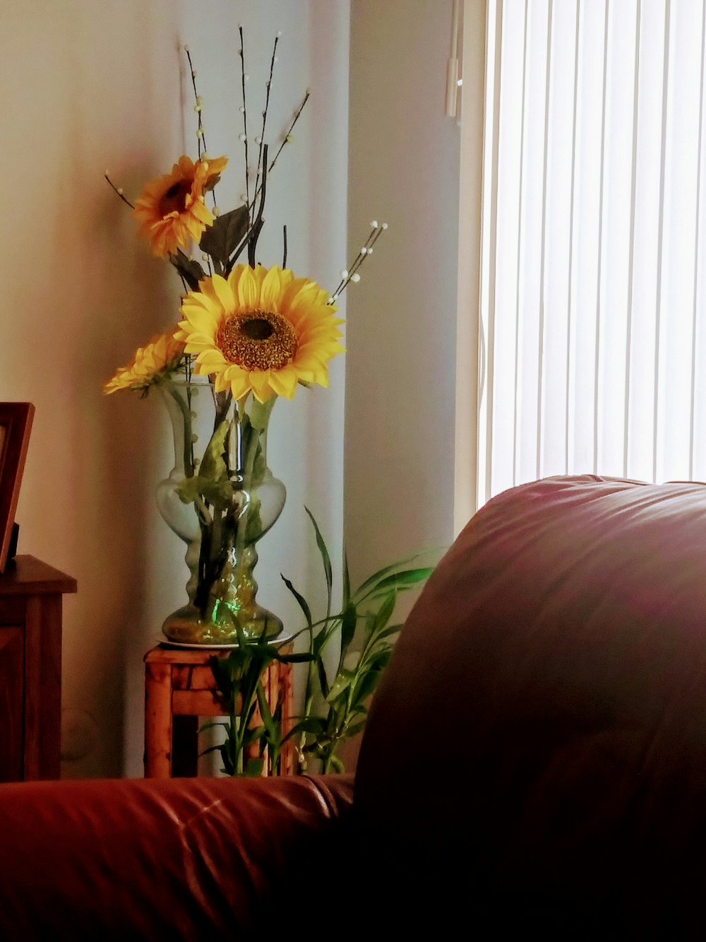 yellow flower in clear glass vase