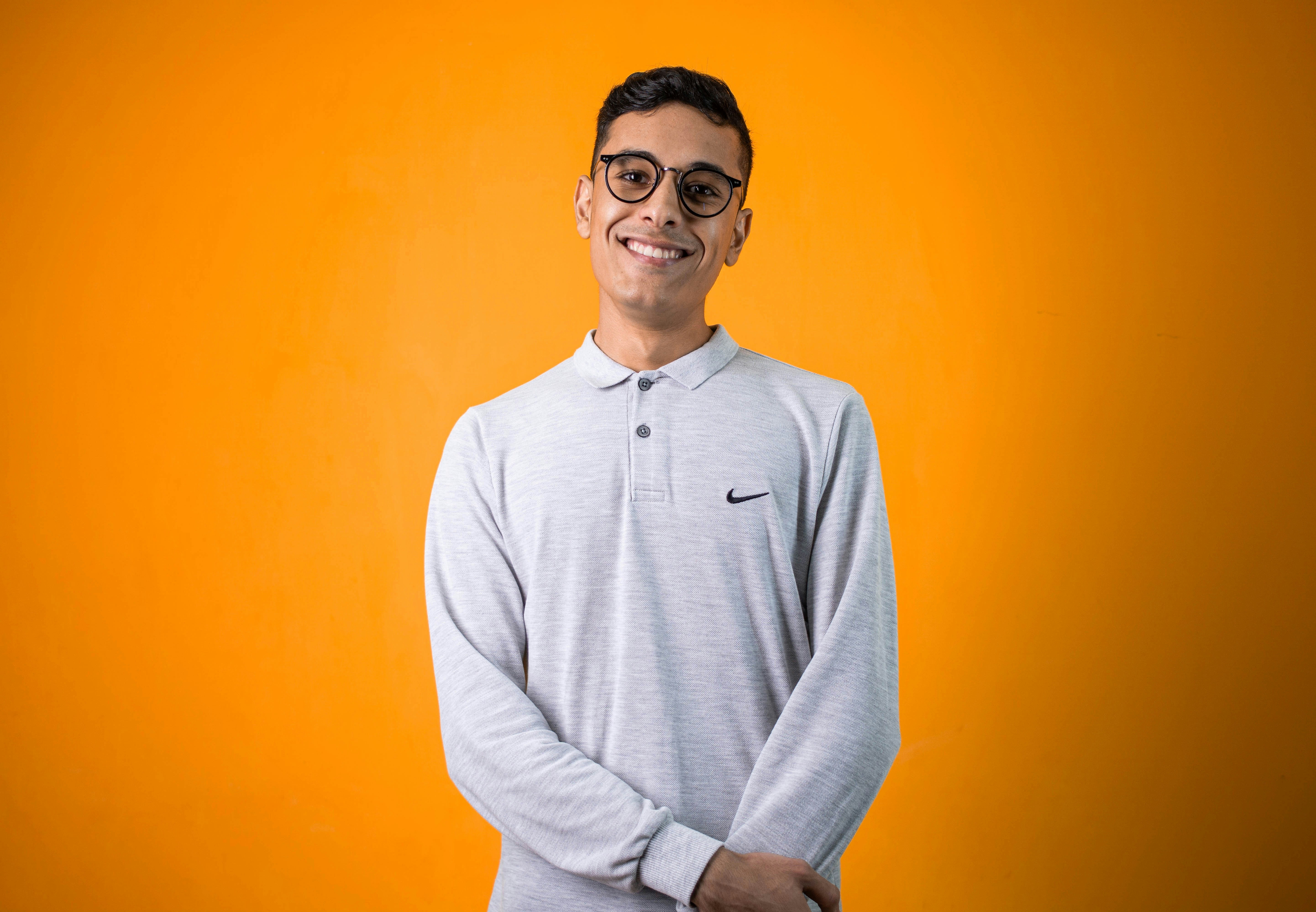 man in gray long sleeve shirt smiling
