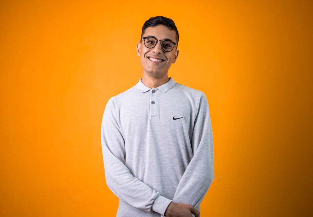 man in gray long sleeve shirt smiling