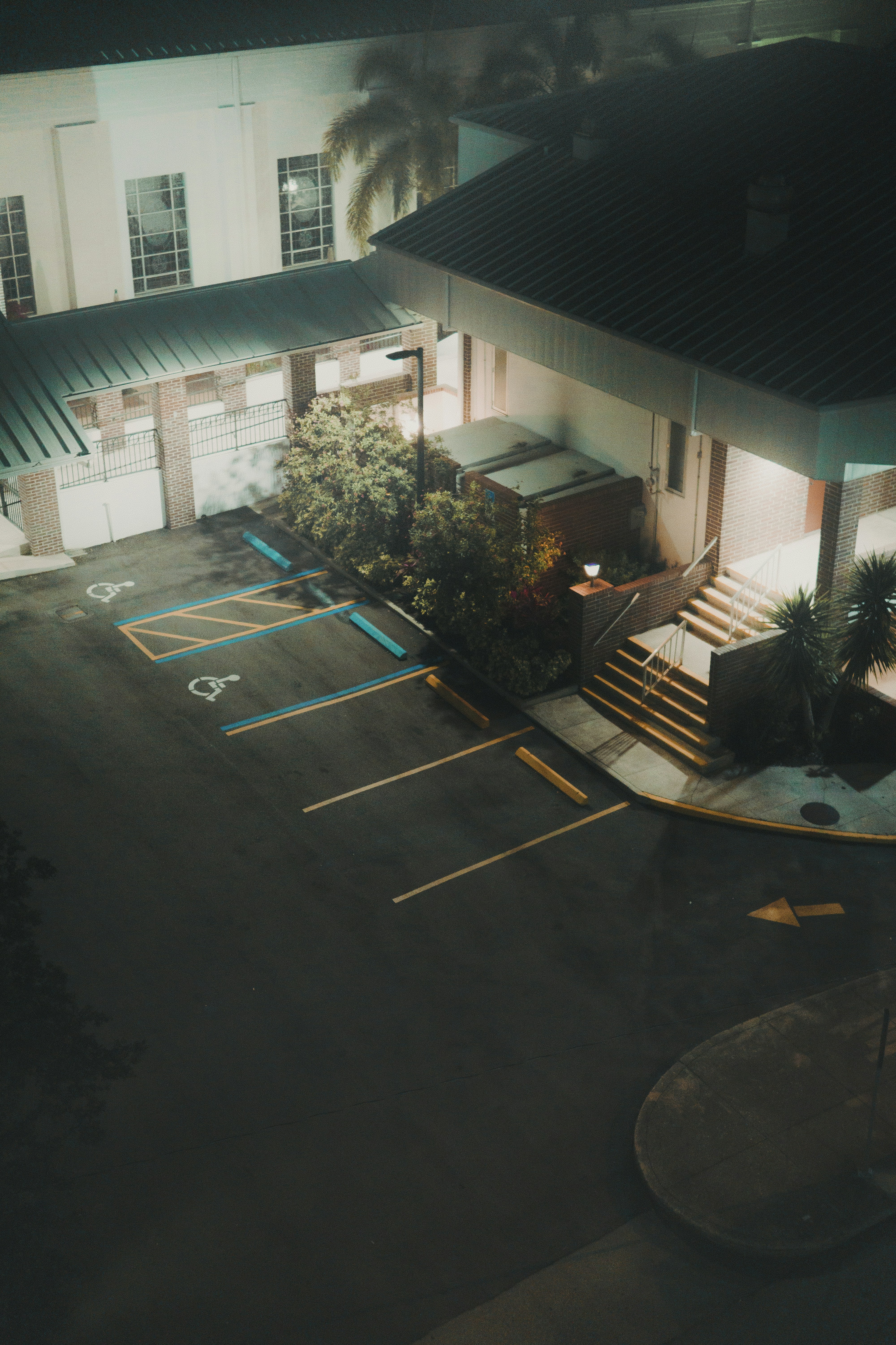 green trees near white concrete building during daytime