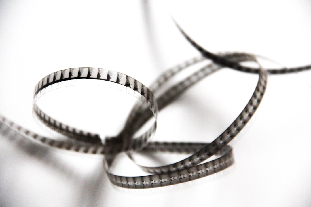 silver and diamond ring on white surface