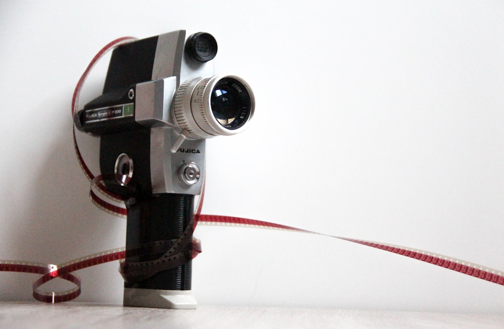 black dslr camera on white table