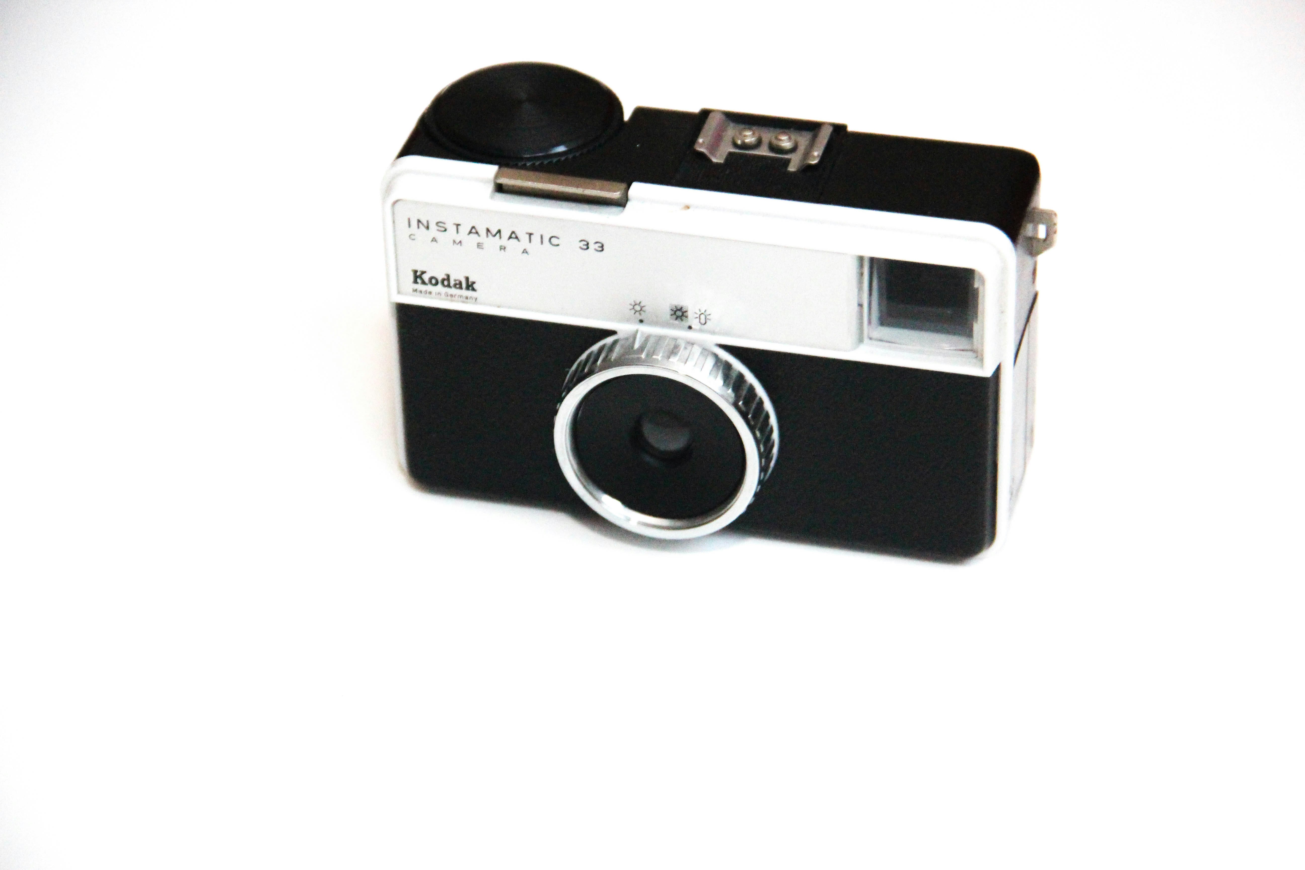 black and silver point and shoot camera