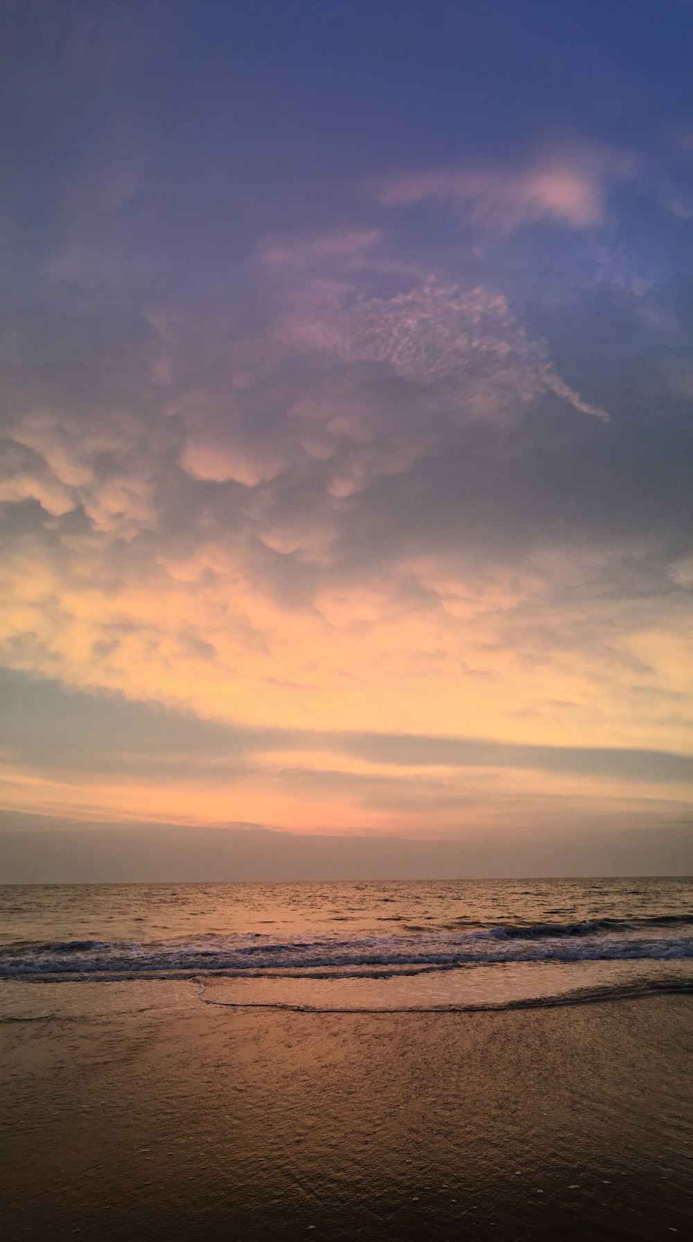 body of water under cloudy sky during daytime