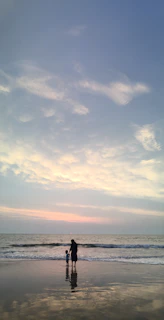 An artistic depiction of a parent and child sharing a quiet moment, surrounded by gentle aqua and royal blue waves that represent understanding and connection.