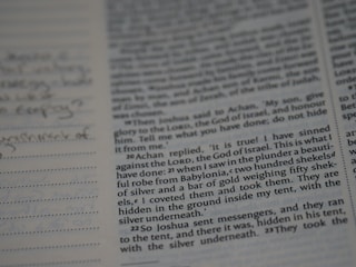 An open manuscript with handwritten editorial notes on cream-colored paper.