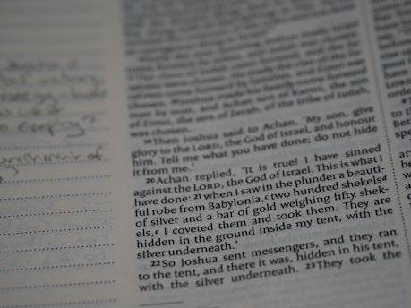 An open manuscript with handwritten editorial notes on cream-colored paper.