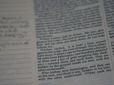 Open book page showing a blend of handwritten notes and digital symbols.