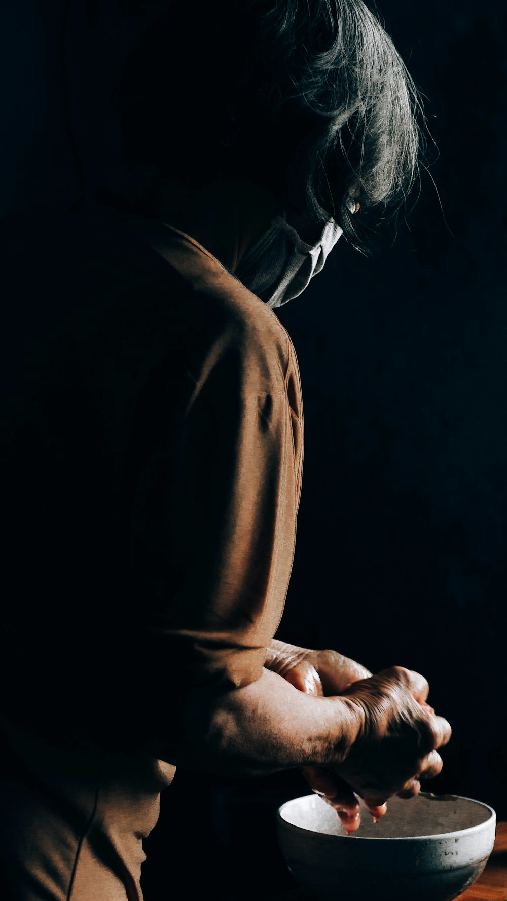 woman in brown long sleeve shirt