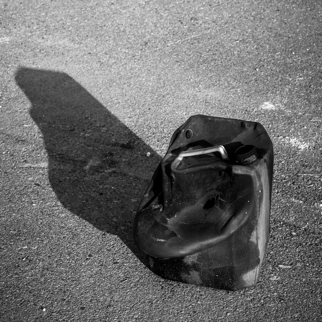 black plastic bag on gray concrete floor