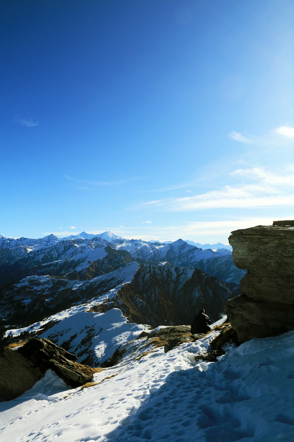 snow covered mountains under blue sky during daytime