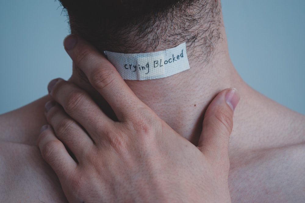 person with white paper on his head