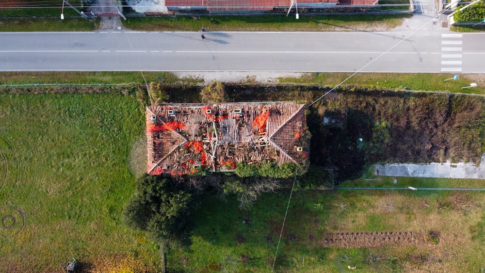 aerial view of green trees and red and white building