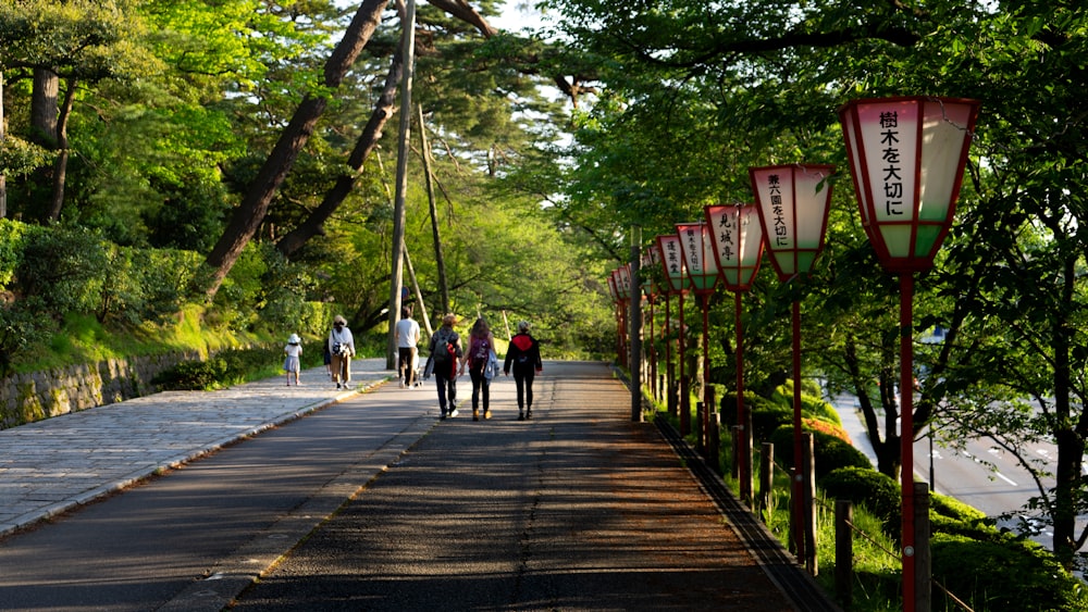 people walking on wooden bridge during daytime